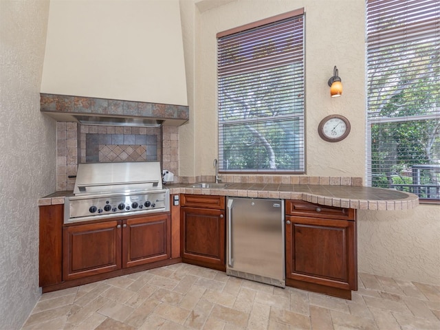 kitchen with sink and refrigerator