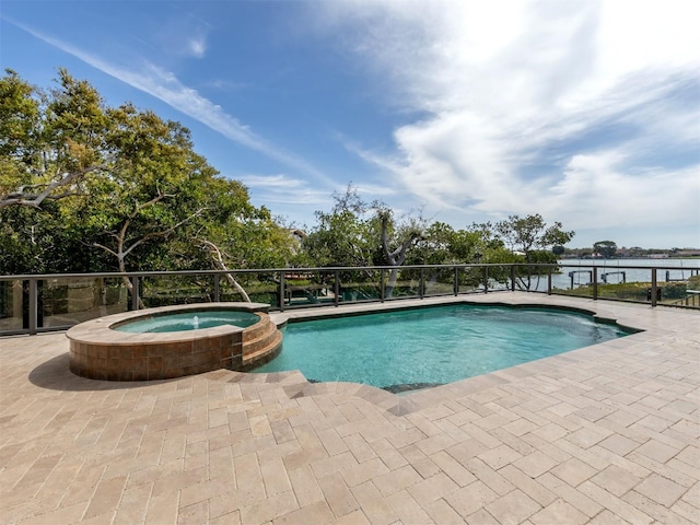 view of swimming pool featuring a patio area, an in ground hot tub, and a water view