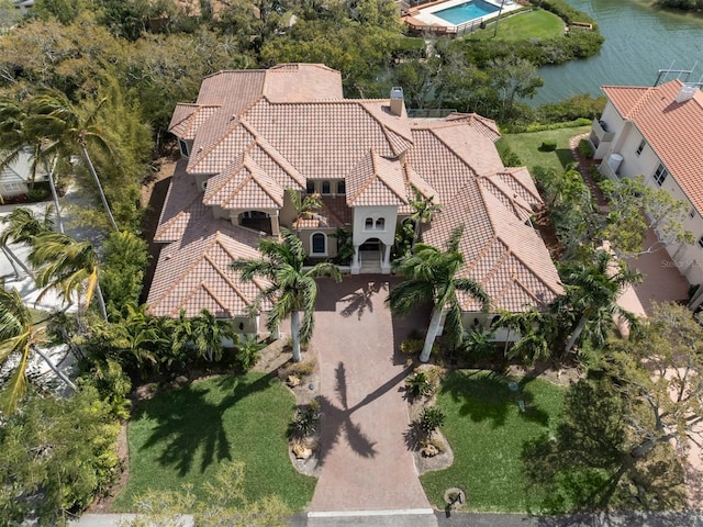 birds eye view of property with a water view