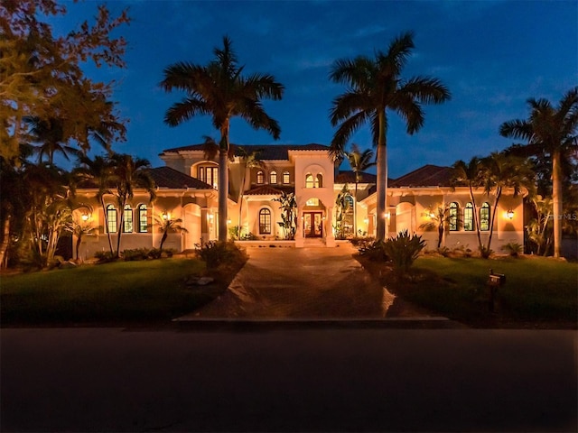 mediterranean / spanish house featuring french doors