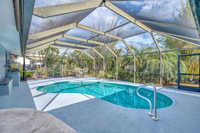 view of pool featuring a lanai and a patio area