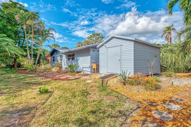 exterior space with a yard and a storage unit