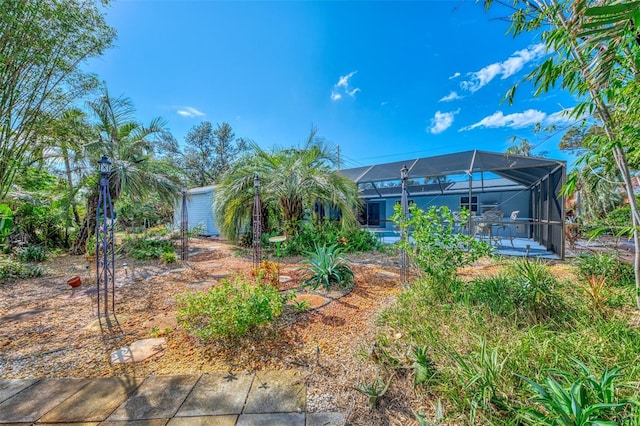 view of yard featuring a lanai