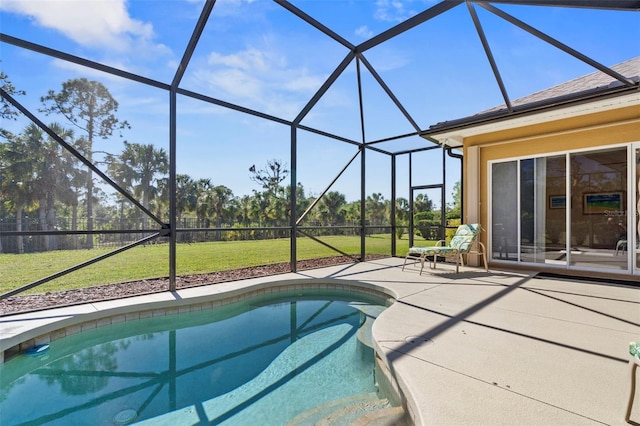 view of swimming pool with a yard, a patio, and a lanai