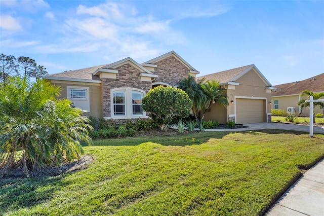 view of front of house with a garage and a front lawn