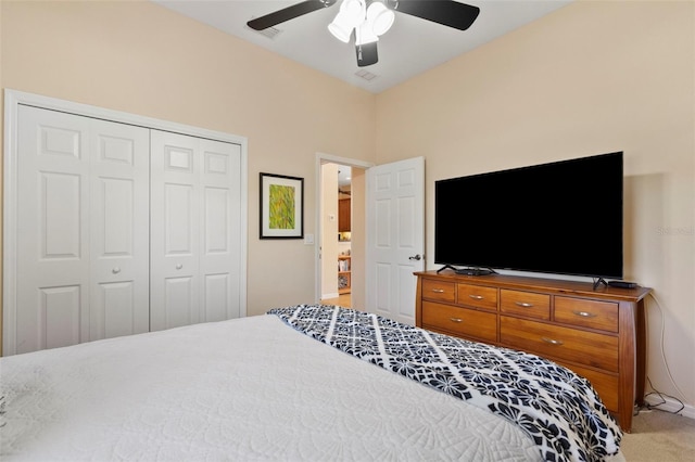 bedroom with ceiling fan, a closet, and carpet