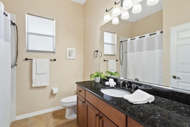 bathroom featuring a shower with curtain, vanity, toilet, and a wealth of natural light