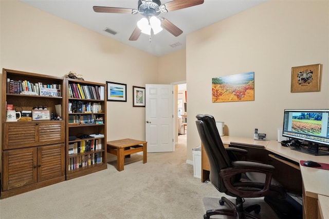 office area featuring ceiling fan and light colored carpet