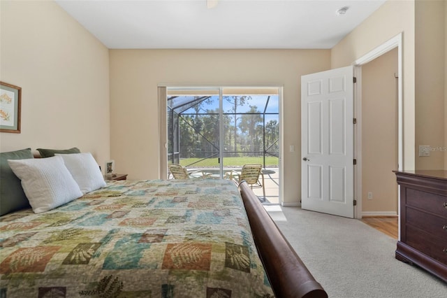 carpeted bedroom with access to outside