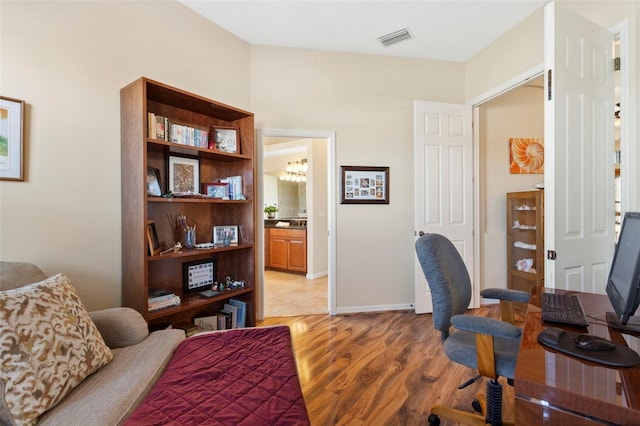 office space with light wood-type flooring