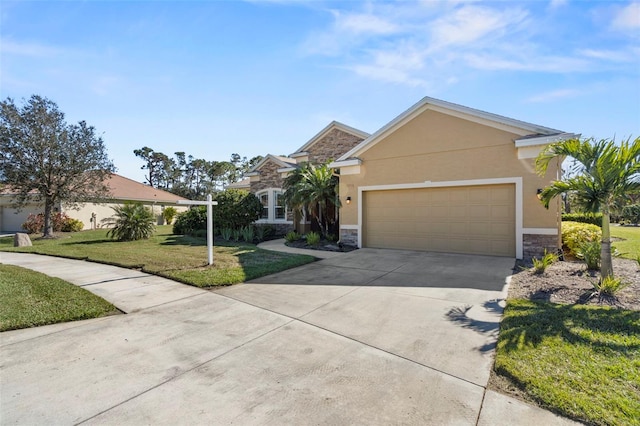 view of front of property featuring a garage and a front lawn