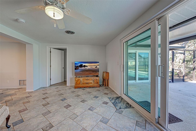 spare room with ceiling fan