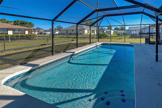 view of pool featuring a yard and a lanai