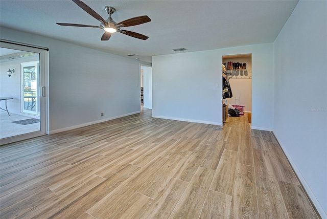 spare room featuring ceiling fan and light hardwood / wood-style floors