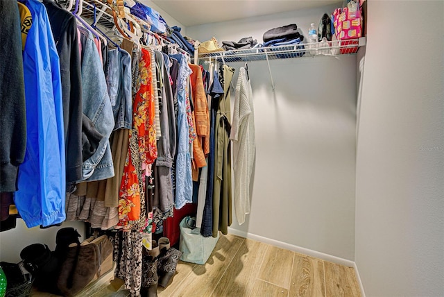 spacious closet featuring hardwood / wood-style floors