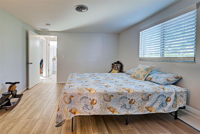 bedroom with light hardwood / wood-style flooring