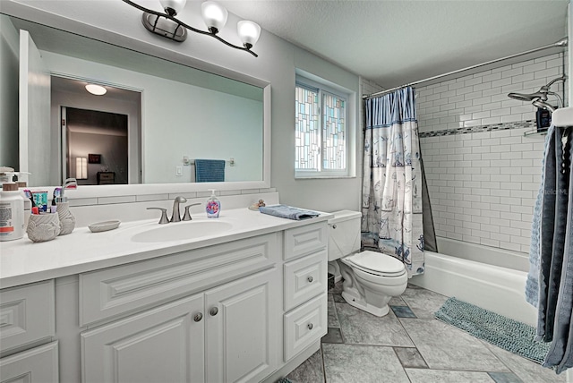 full bathroom with vanity, shower / bath combo, and toilet