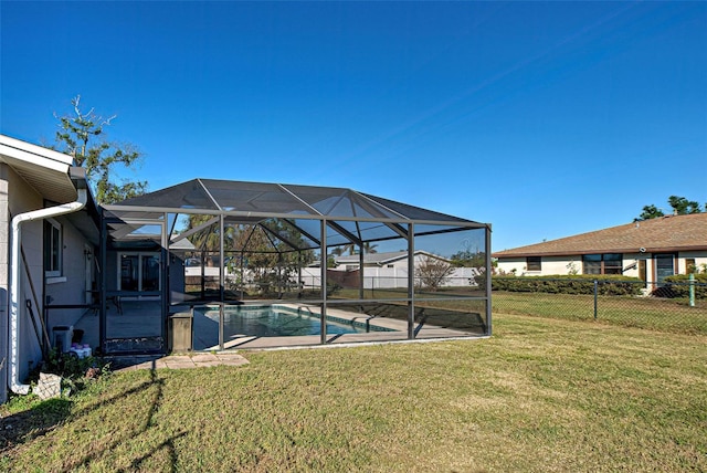 view of yard with a fenced in pool, a patio area, and a lanai