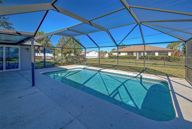 view of pool with a lanai, a yard, and a patio