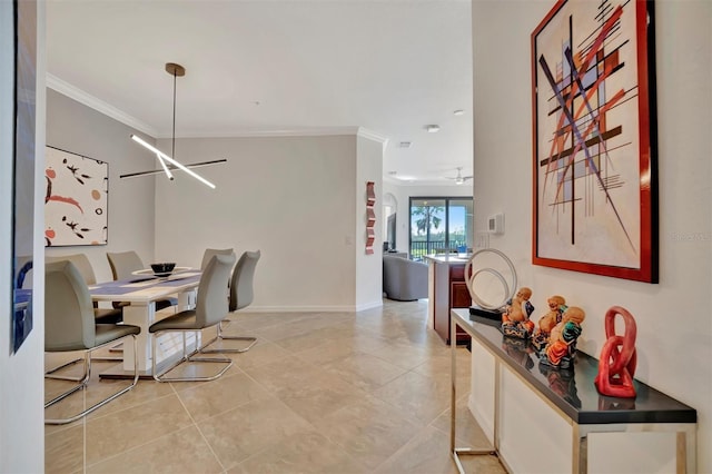 tiled dining area with ceiling fan with notable chandelier and crown molding