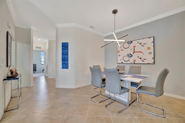 dining space featuring light tile patterned floors, an inviting chandelier, and crown molding