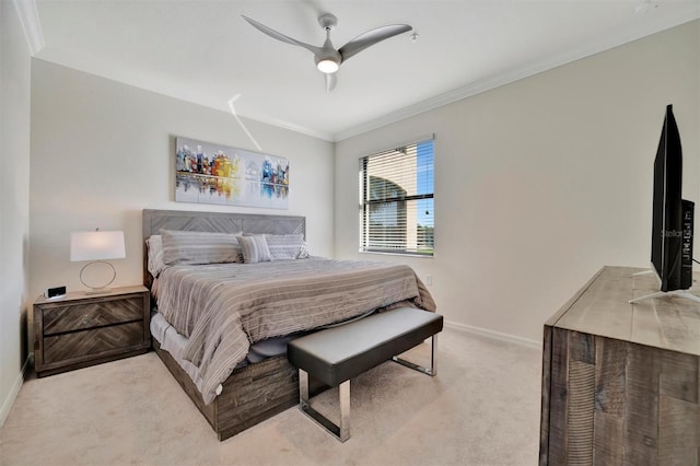 bedroom featuring ceiling fan, light colored carpet, and crown molding