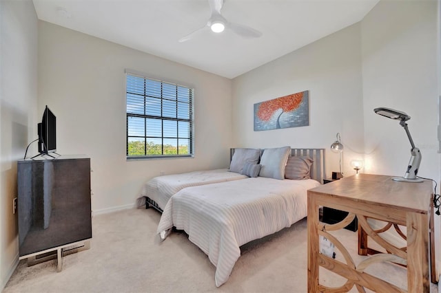 bedroom with light carpet and ceiling fan