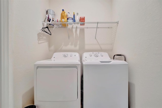 washroom featuring washer and clothes dryer