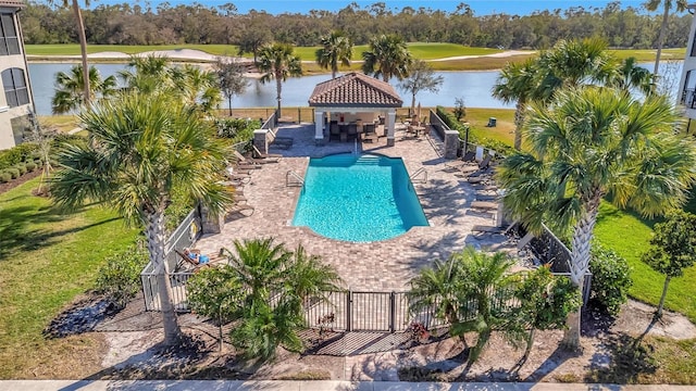 view of swimming pool featuring a gazebo, a patio area, and a water view