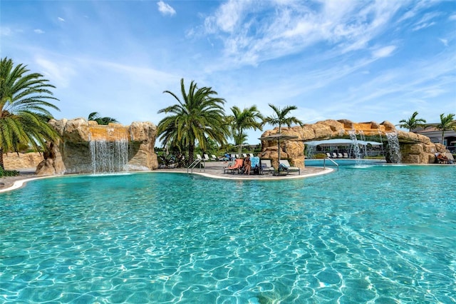 view of pool with pool water feature