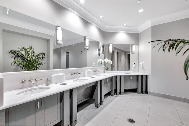 bathroom with tile patterned floors, vanity, and crown molding