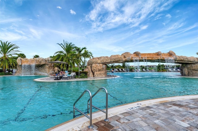 view of pool featuring pool water feature