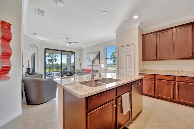 kitchen featuring ceiling fan, sink, stainless steel dishwasher, crown molding, and an island with sink