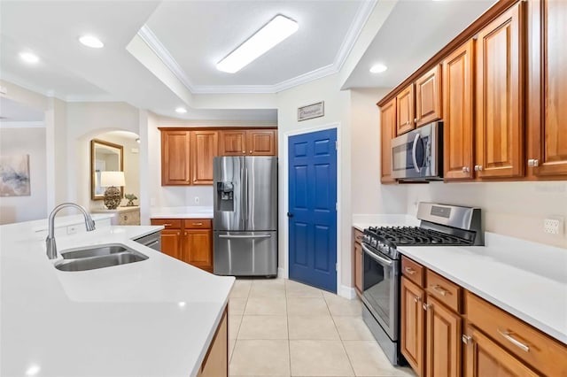 9607 Sea Turtle Ter Unit 101, Bradenton, FL 34212 - kitchen with stainless steel appliances, crown molding, light countertops, brown cabinets, and recessed lighting