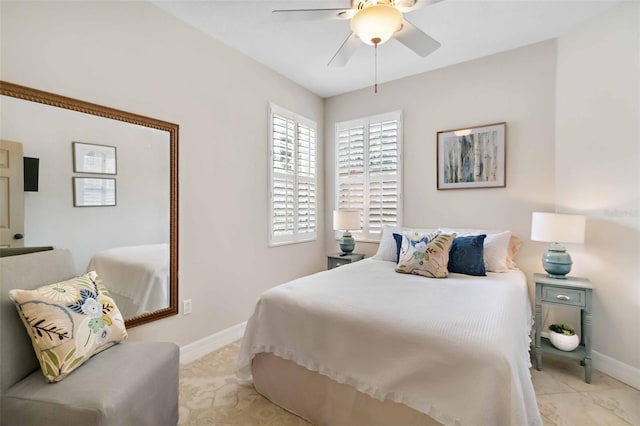 9607 Sea Turtle Ter Unit 101, Bradenton, FL 34212 - bedroom featuring baseboards and ceiling fan