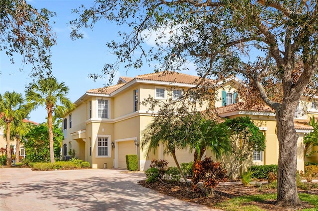 mediterranean / spanish-style home featuring a garage