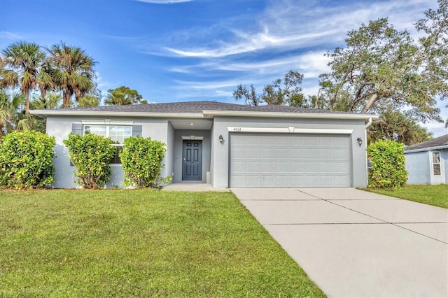 view of front of home featuring a garage and a front yard