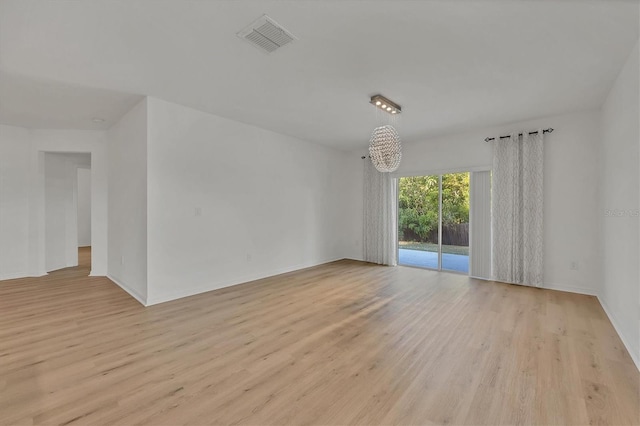 unfurnished room featuring light hardwood / wood-style flooring