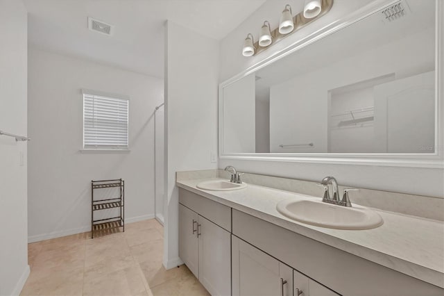 bathroom with vanity and tile patterned floors