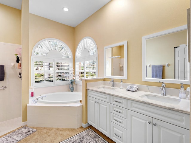 bathroom with separate shower and tub, tile patterned flooring, vanity, and a healthy amount of sunlight