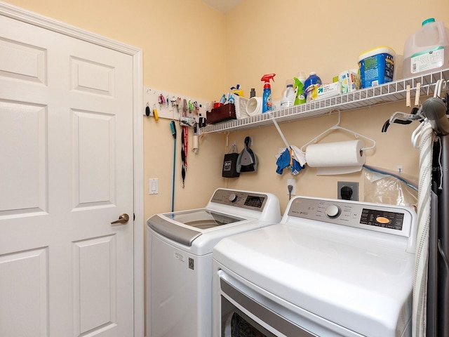 laundry room featuring separate washer and dryer