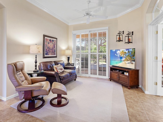 tiled living room with ceiling fan and crown molding