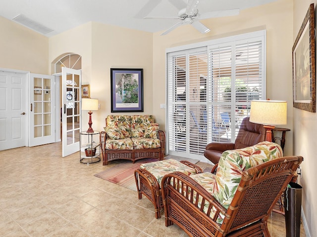 sitting room with ceiling fan, french doors, and light tile patterned floors