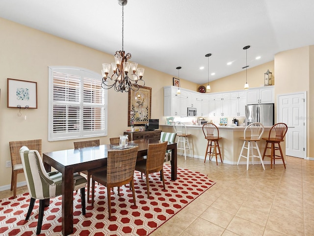 dining room with light tile patterned floors, vaulted ceiling, and an inviting chandelier