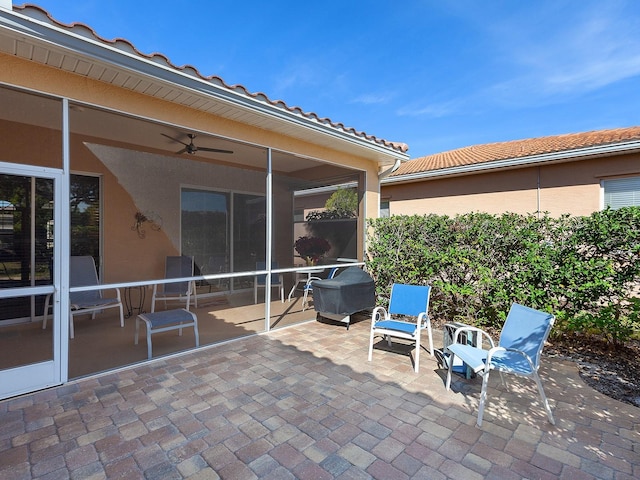 view of patio featuring ceiling fan and a grill