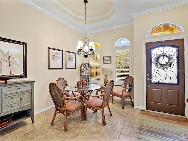 dining space with light tile patterned flooring, crown molding, and a chandelier