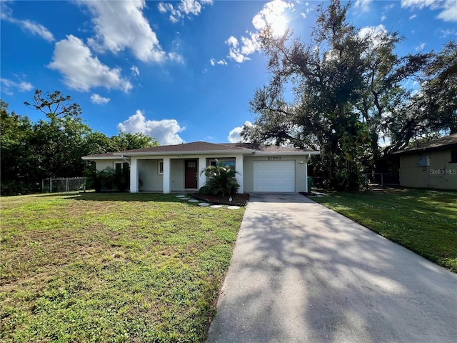 single story home featuring a front lawn and a garage