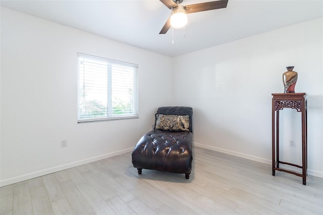 sitting room featuring light wood-type flooring and ceiling fan