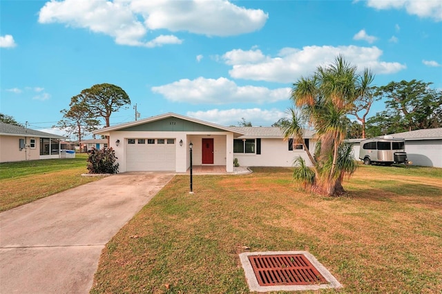 ranch-style home with a front yard and a garage