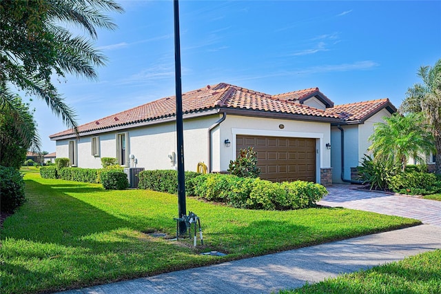 view of property exterior featuring a yard, a garage, and central air condition unit